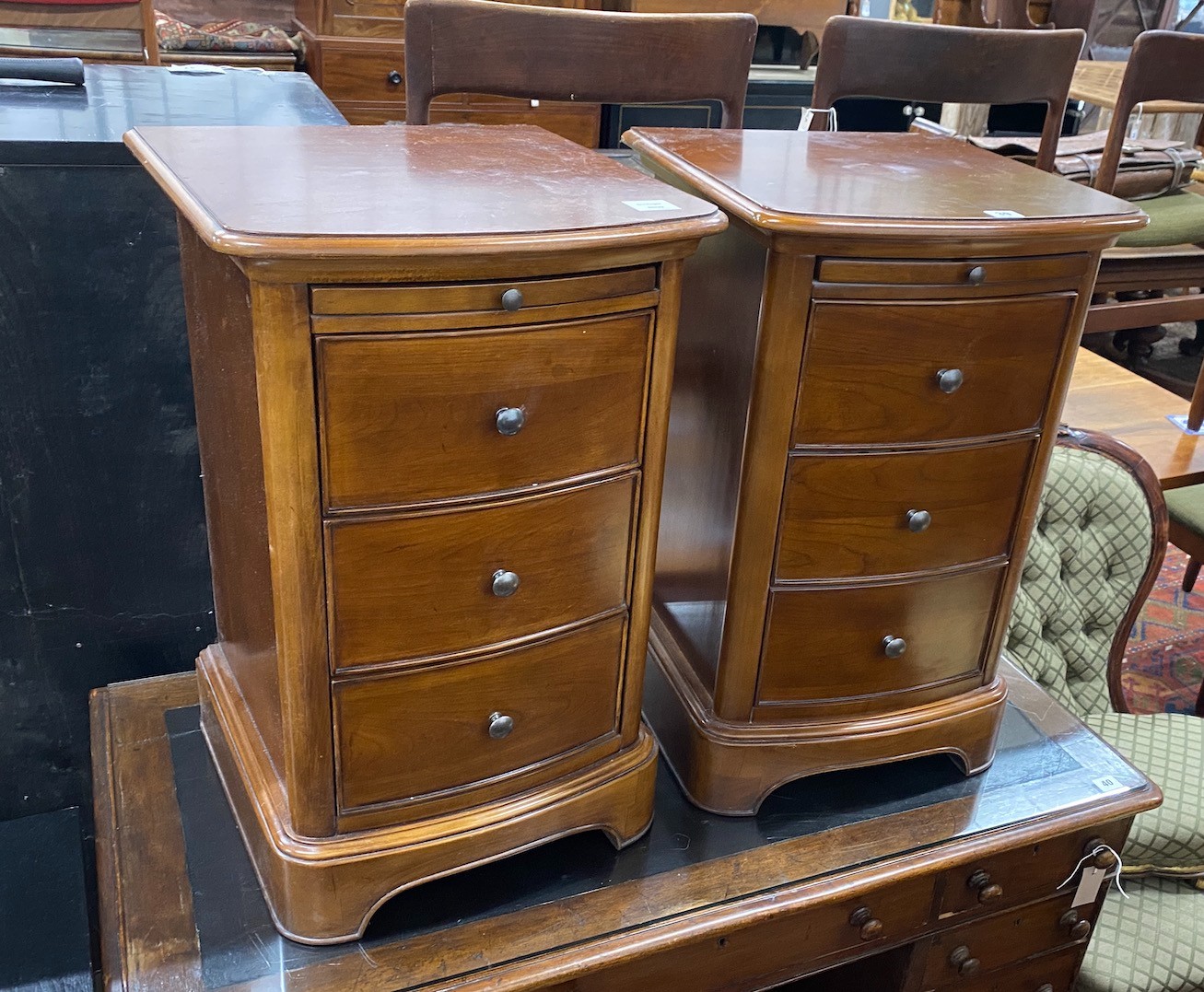 A pair of reproduction cherry three drawer bedside chests with slides, width 43cm, depth 42cm,