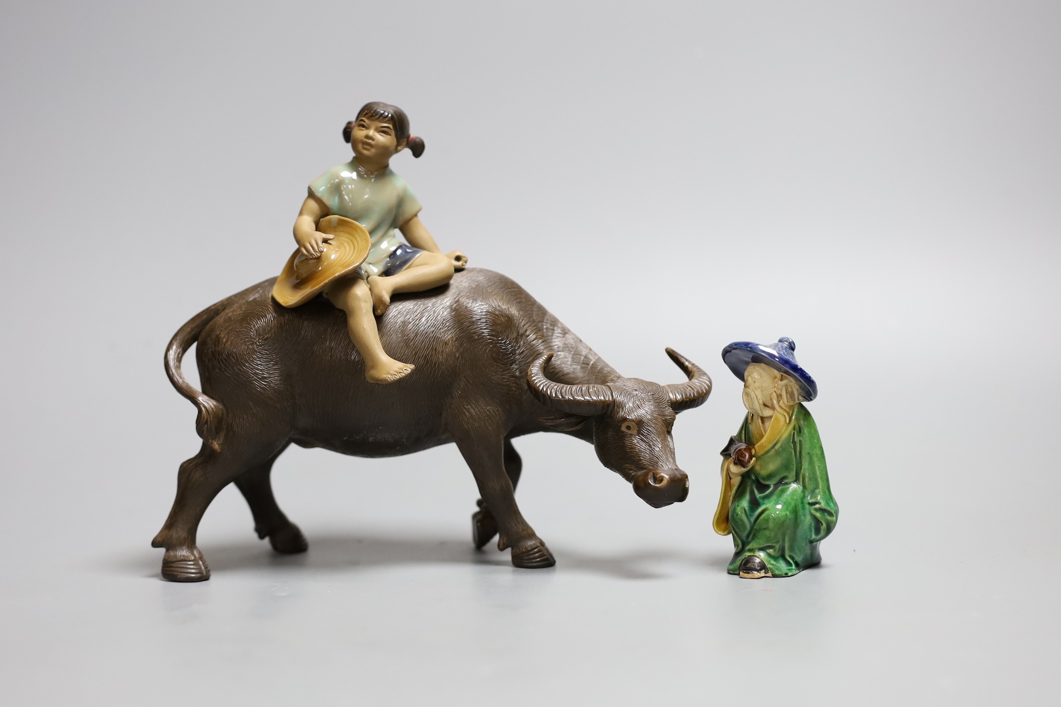 A Chinese Shiwan group of a girl on a buffalo and another,Girl on buffalo 20 cms wide,