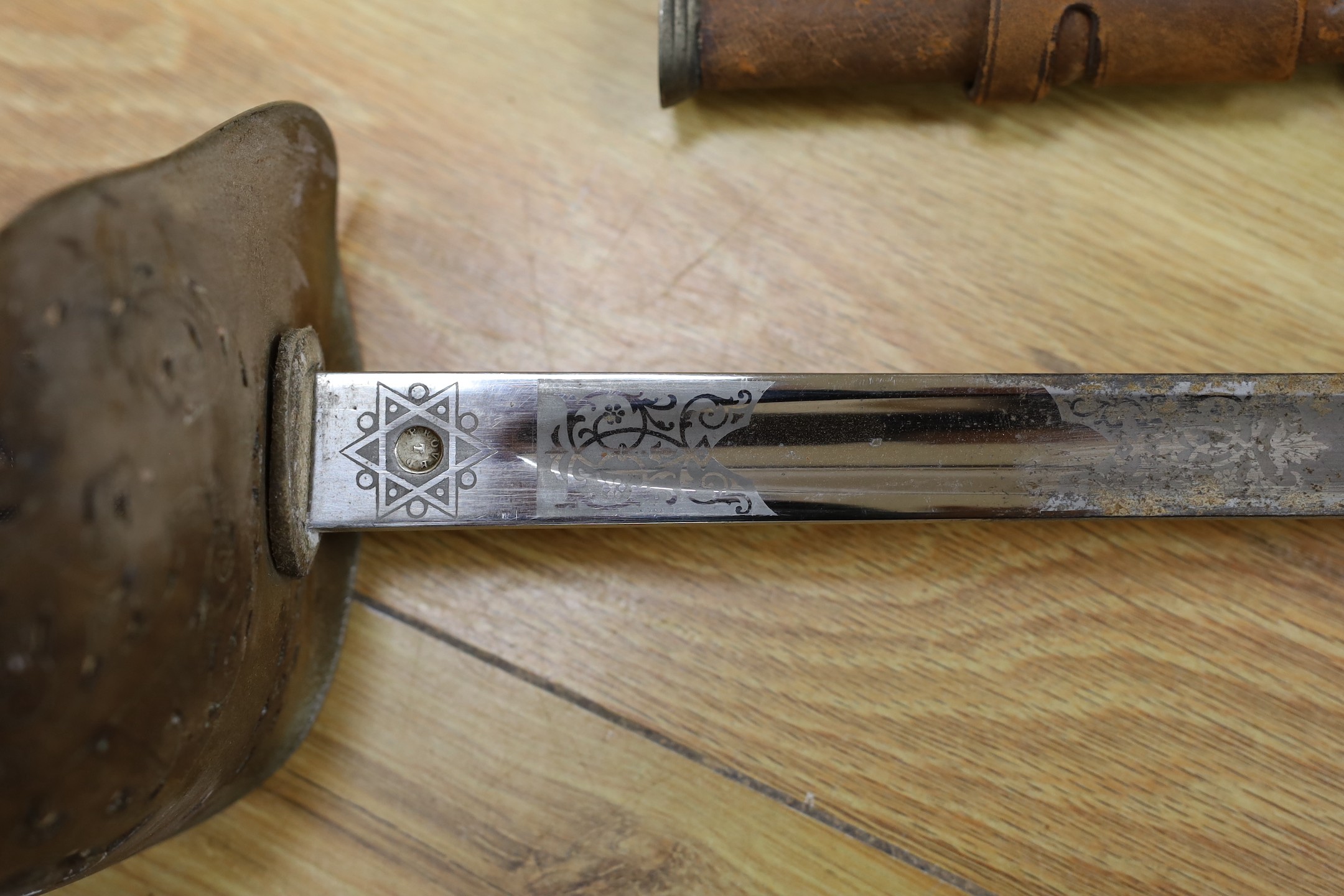 A George V military dress sword in brown leather covered scabbard, 102cm long, and a Middle - Image 5 of 10