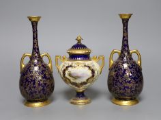 A pair of Royal Worcester bottle vases and a Coalport landscape vignette vase and cover, pair of