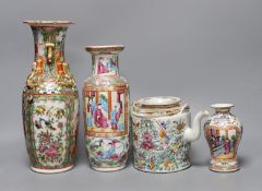Three Chinese famille rose vases and a teapot, late 19th/early 20th century, tallest vase 29.5 cms