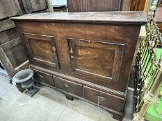A mid 18th century fruitwood mule chest, adapted, with two panelled doors over three drawers,
