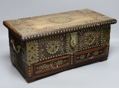 An Indian brass studded and mounted box, 45cms wide x 21cms high,