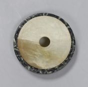 Two Chinese bi discs; in bowenite jade and black and green hardstone, largest 7cm diameter