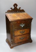 An 18th century and later oak spice cupboard, 53 cms high