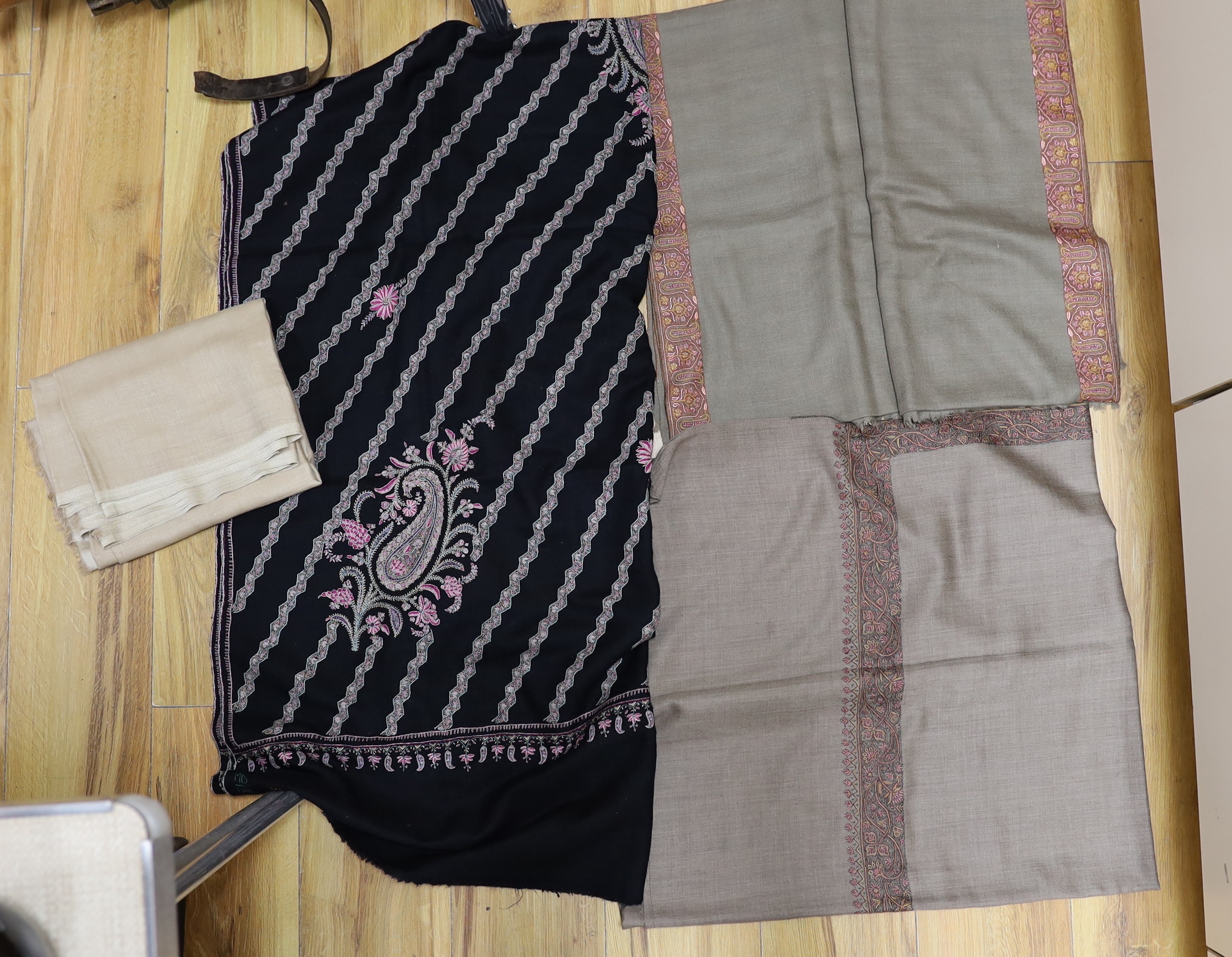 Four Indian wool and cashmere shawls, three silk embroidered,