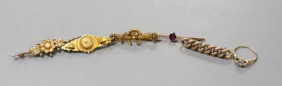 Two early 20th century 9ct and gem set bar brooches, gross weight 4.7 grams, a similar 15ct