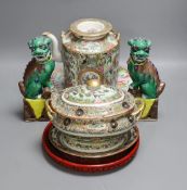A Cantonese famille rose plate and teapot with cover, a pair of Chinese seated dogs, and a tureen