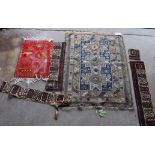 An antique Caucasian Derbend rug, 160 x 108cm, a smaller red ground rug and rug fragments