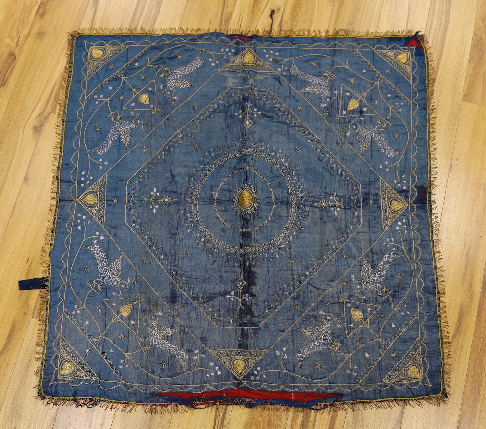 A late 19th century Indian silk and metal thread embroidered panel, approx: 118cms x118 cms,