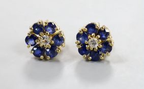 A pair of yellow metal, sapphire and diamond set flower head cluster earrings, 9mm, gross weight 3.7