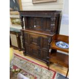 A 17th century carved oak press cupboard, width 112cm, depth 51cm, height 159cm