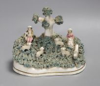 A Staffordshire porcelain lambing group, c.1830-50, 13.5cm tall