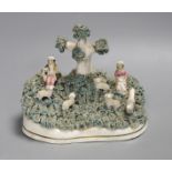 A Staffordshire porcelain lambing group, c.1830-50, 13.5cm tall