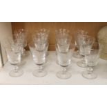 A set of twelve Stephen Rickard engraved glasses, 15cm tall