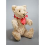 A small Steiff bear, with button in ear, c.1920, 14cm high