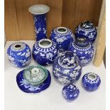 Eight Chinese blue and white ginger jars, one prunus vase and two others, the vase 25 cm high