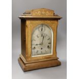 An early 20th century German inlaid rosewood striking and chiming eight day bracket clock, 42cm