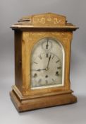 An early 20th century German inlaid rosewood striking and chiming eight day bracket clock, 42cm