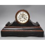 A French black slate and rouge marble mantel clock by Henry Marc, with key and pendulum, 28.5cm