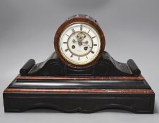 A French black slate and rouge marble mantel clock by Henry Marc, with key and pendulum, 28.5cm