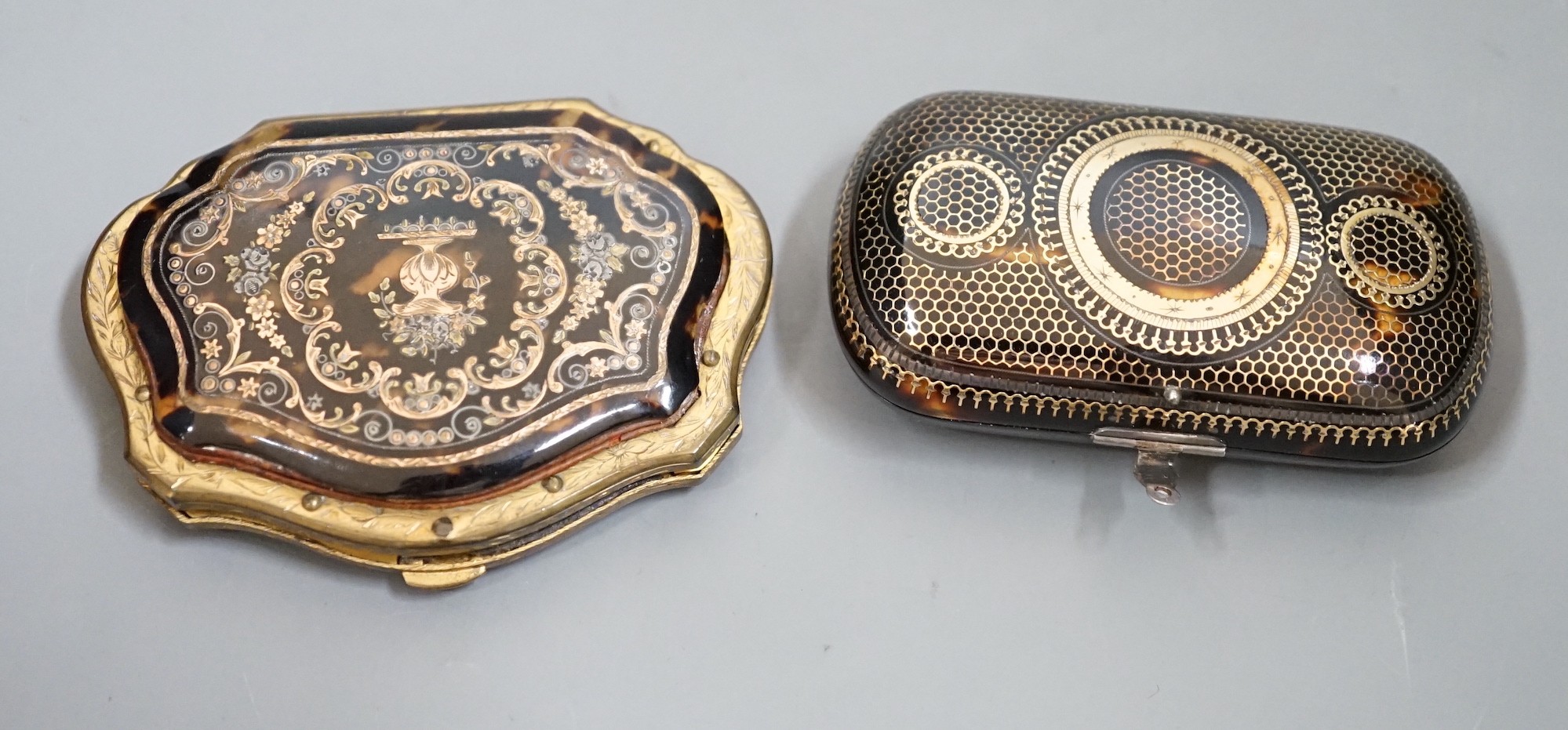 A 19th century finely worked tortoiseshell piqué work purse, with blue silk lining and a similar git