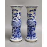 A pair of 19th century Chinese blue and white 'rockwork, birds and flowers' gu vases, 26cm