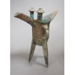 A Chinese archaistic bronze vessel, jue, 21cm high