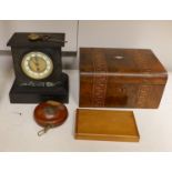 A Victorian black slate mantel clock, a parquetry writing box, a surveyor's measure, a cased