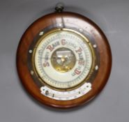 A Victorian aneroid barometer with mother-of-pearl inlaid decoration, 27cm diameter