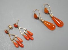 A pair of yellow metal and triple drop coral earrings, 30mm, gross 4.4 grams and a pair of carnelian