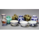 A Chinese brass tea caddy and kettle together with three similar blue and white porcelain bowls,