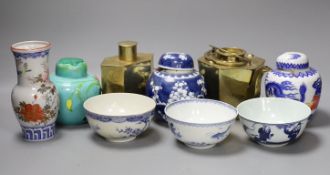 A Chinese brass tea caddy and kettle together with three similar blue and white porcelain bowls,