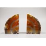 A pair of banded agate geode bookends, 10.5cm high