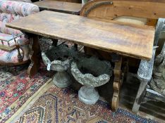 A Spanish walnut centre table, with wrought iron stretcher, width 151cm depth 69cm height 75cm