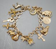 A 9ct gold charm bracelet, hung with assorted charm, including wagon, key, monkey etc. some 9ct