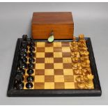 A late 19th / early 20th century weighted Staunton chess set, red crown stamps, kings 7.5cm, with