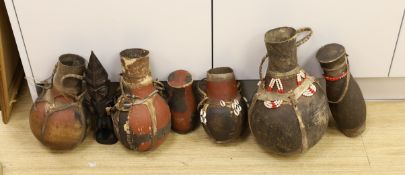 A large quantity of African wood carvings, gourd water carriers, etc.