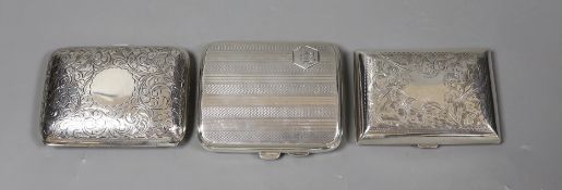 Three assorted engraved silver cigarette cases, largest 82mm.