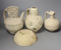 Three Islamic terracotta jugs and a strainer, Middle Eastern possibly, 12th century, tallest 24cm