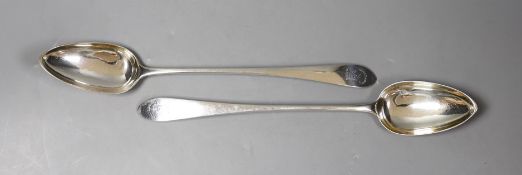 A pair of George III Scottish silver Celtic tip basting spoons, with engraved crest, Patrick