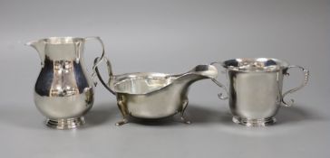 A small silver jug, Birmingham 1946 by Thomas Ducrow & Sons, together with a silver two handled cup,