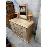 A late 19th century stripped pine dressing chest, fitted with two short and three long drawers,