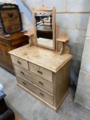 A late 19th century stripped pine dressing chest, fitted with two short and three long drawers,