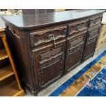 An 18th century French Provincial oak buffet, lacking two feet, width 171cm depth 48cm height 110cm