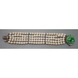 A quintuple strand cultured pearl bracelet, with carved jade set 9ct white metal clasp, 17cm,