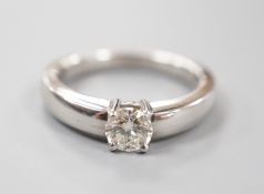 A modern platinum and solitaire diamond ring, size M, gross weight 8.7 grams, the diamond weighing