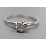 A white metal (stamped plat) and solitaire diamond ring, size O, gross weight 2.3 grams.