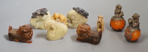 Two carved horn Buddhistic lions, four soapstone carvings and a pair of Chinese nickel and amber-