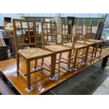 A set of five Heals Cotswold oak dining chairs, including one carver